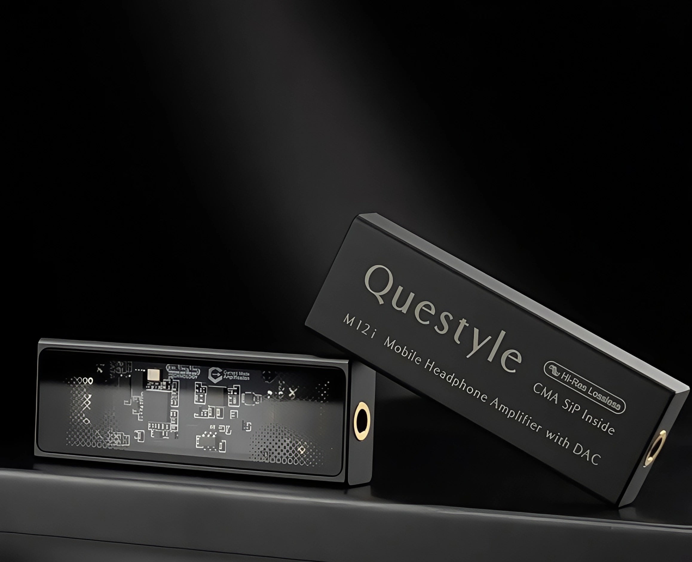 Questyle M12i mobile headphone amplifier with DAC, product shown with packaging box, featuring transparent panel design.